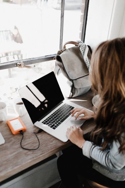 woman on a laptop at a window